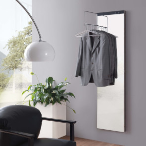 Joy is a tall and thin mirror coat stand that folds open to reveal a set of coat hooks or a pull-out hanger rail